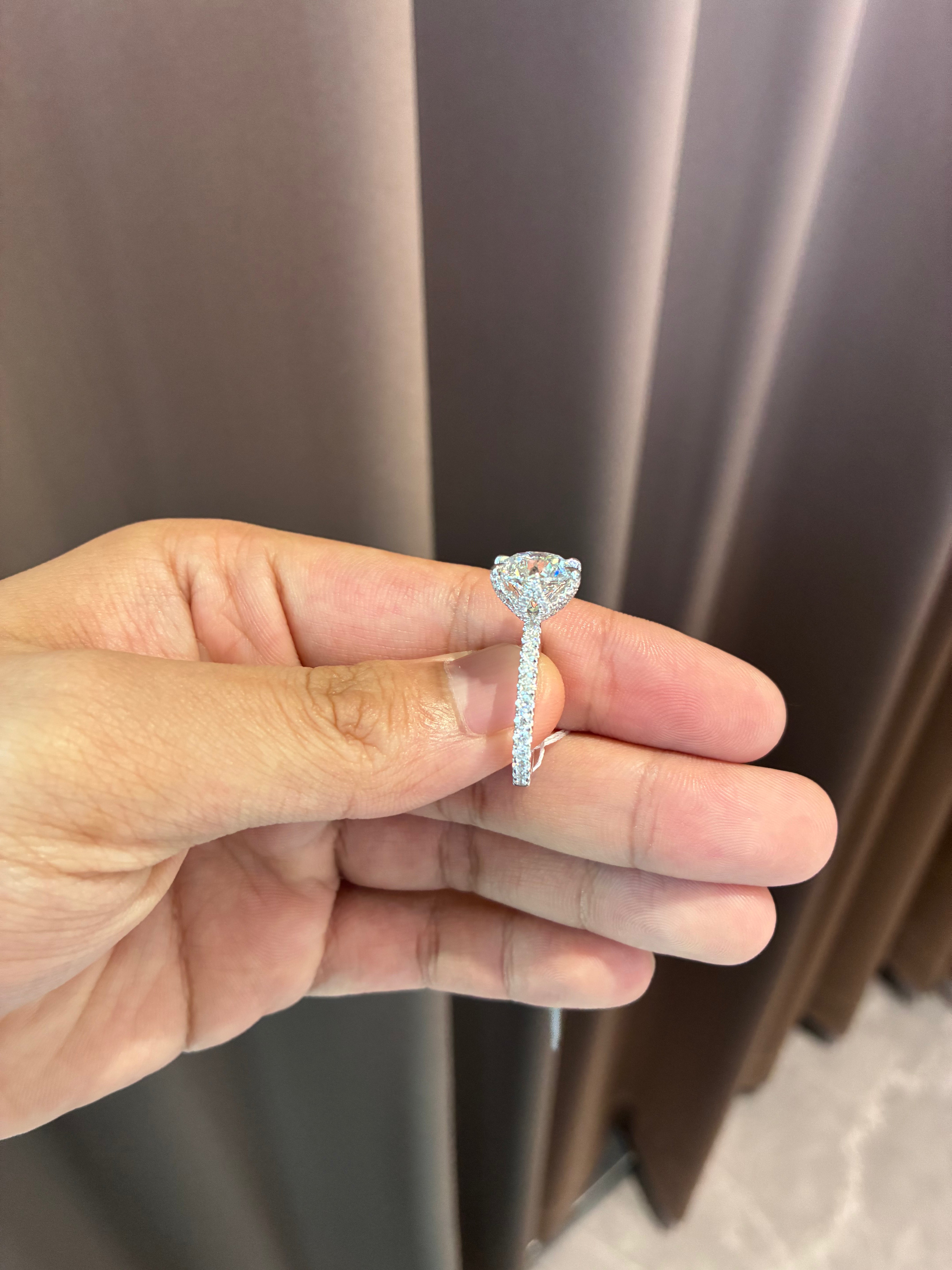Deposit For Lauren 1️⃣14k white gold ring with 3ct D vvs2 diamond And 1ct side stones2️⃣Each 1.5ct total 3ct round diamond earrings 14k white gold six prongs