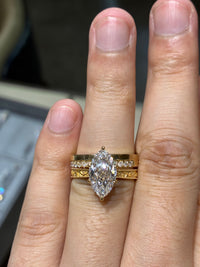 3 carat 18k gold marquiss ring and 14k, 0.323 carat eternal ring