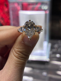 For HONEYYB, deposit (14K gold pear cut, 3.03ct center stone, 0.741ct pavé side stones, E color, VS1 clarity )
