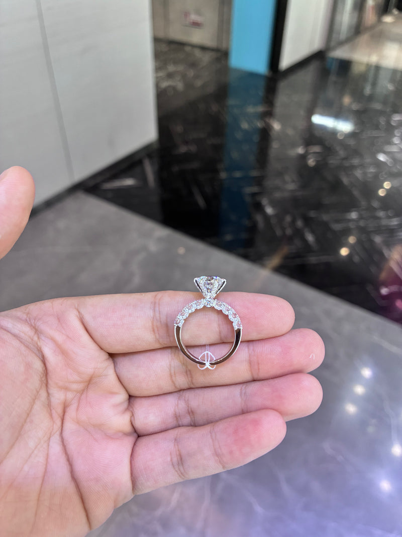For Dianna O. 18k white gold ring with 2.050ct D VVS2 main diamond and 1.210ct side diamonds need engraving