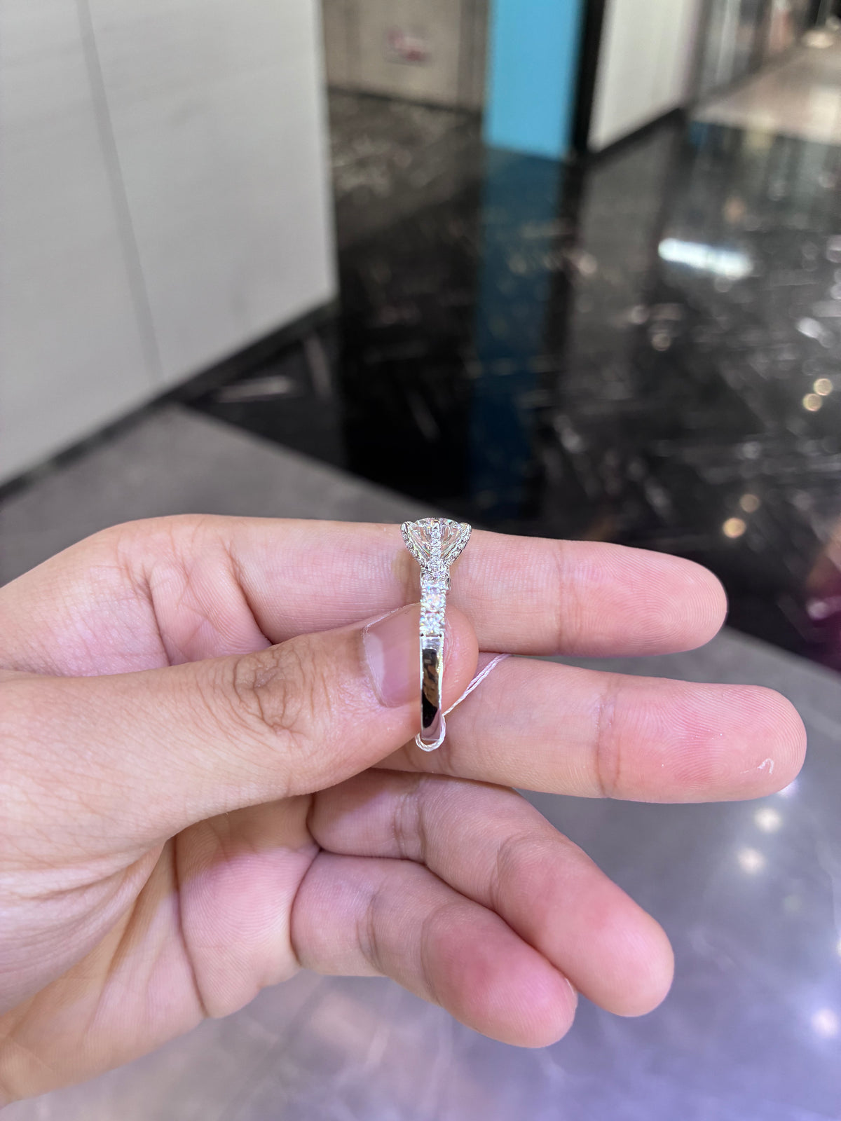For Dianna O. 18k white gold ring with 2.050ct D VVS2 main diamond and 1.210ct side diamonds need engraving