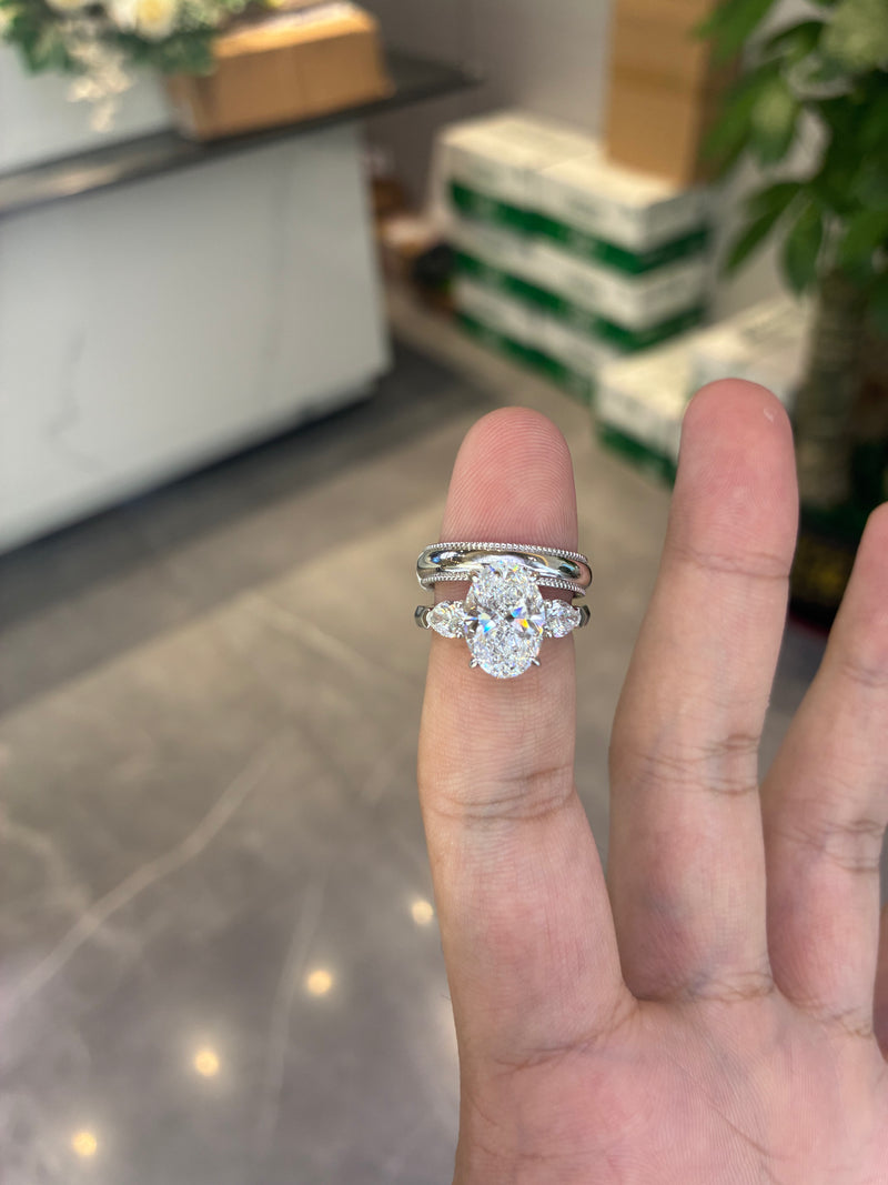For user1680024449362 18k white gold ring with 3ct D VVS2 main stone And 18k white gold band