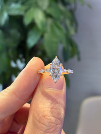 2.03 carats marquis E/VVS2 with 0.442 total carats side diamonds in 26 pieces in 14k yellow solid yellow gold