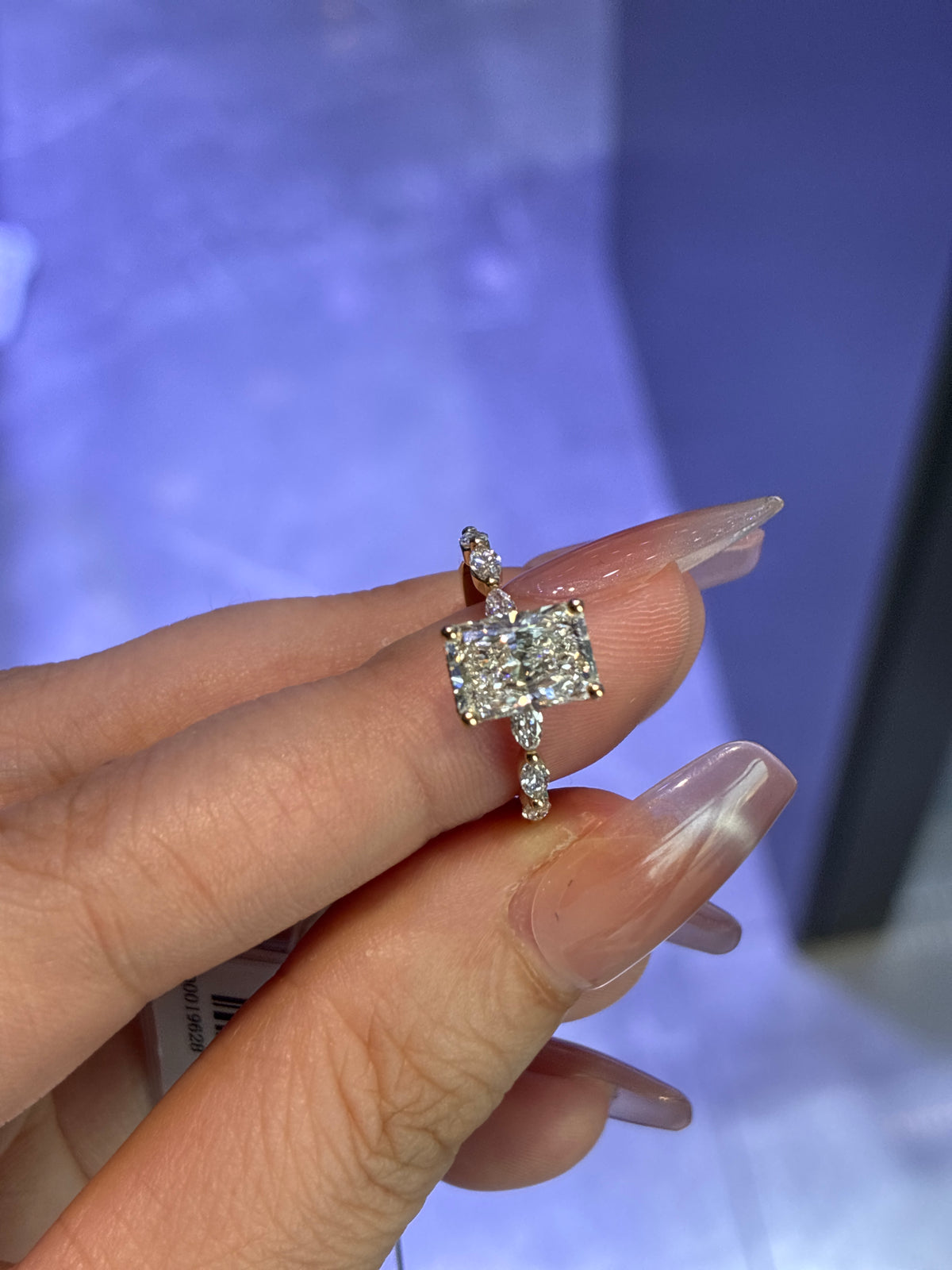 For Emma 14k yellow 2ct radiant E/vvs2 with 0.464ct side stones