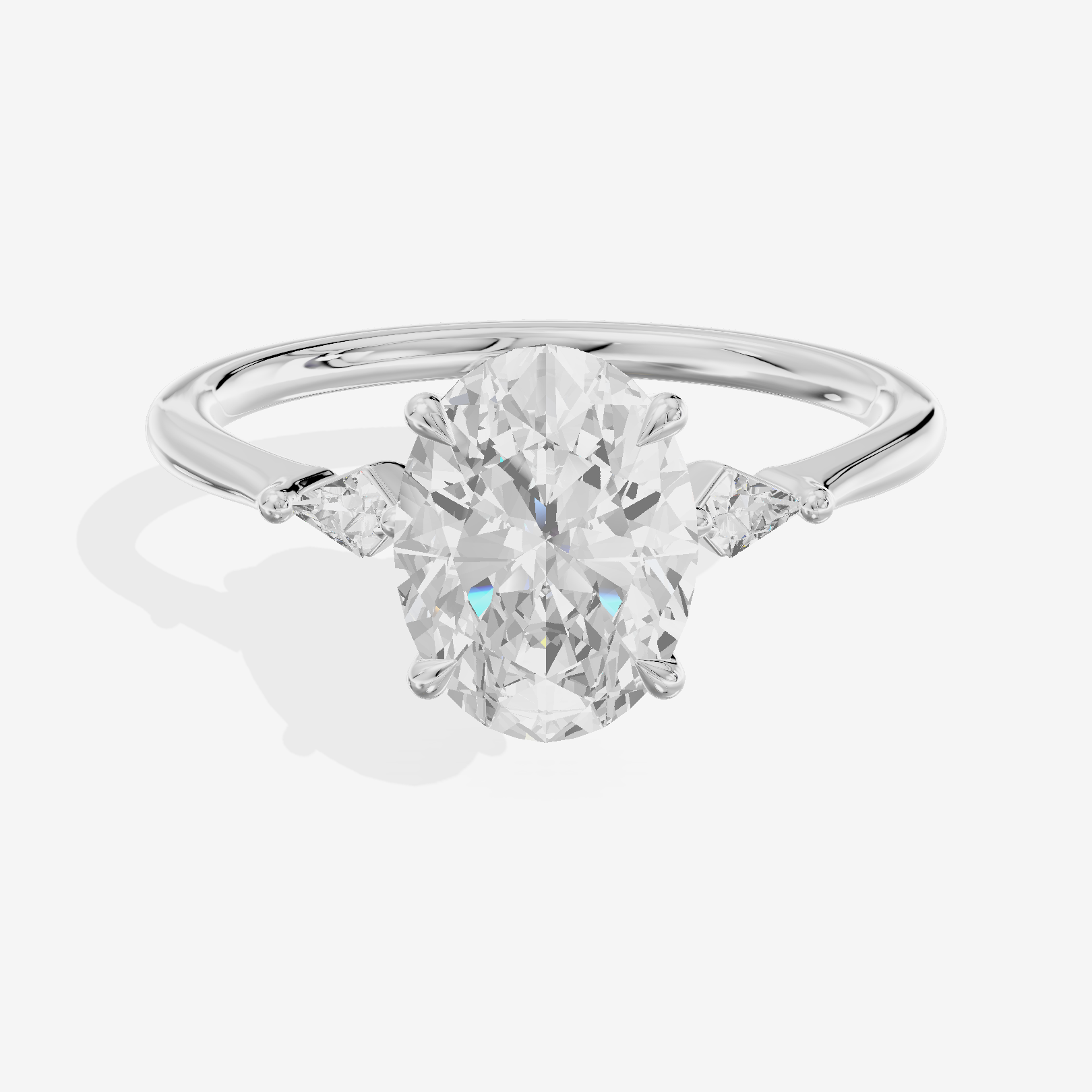 Petite Triade Oval Three Stone Engagement Ring (1/15 ct. tw.) in 18K White Gold