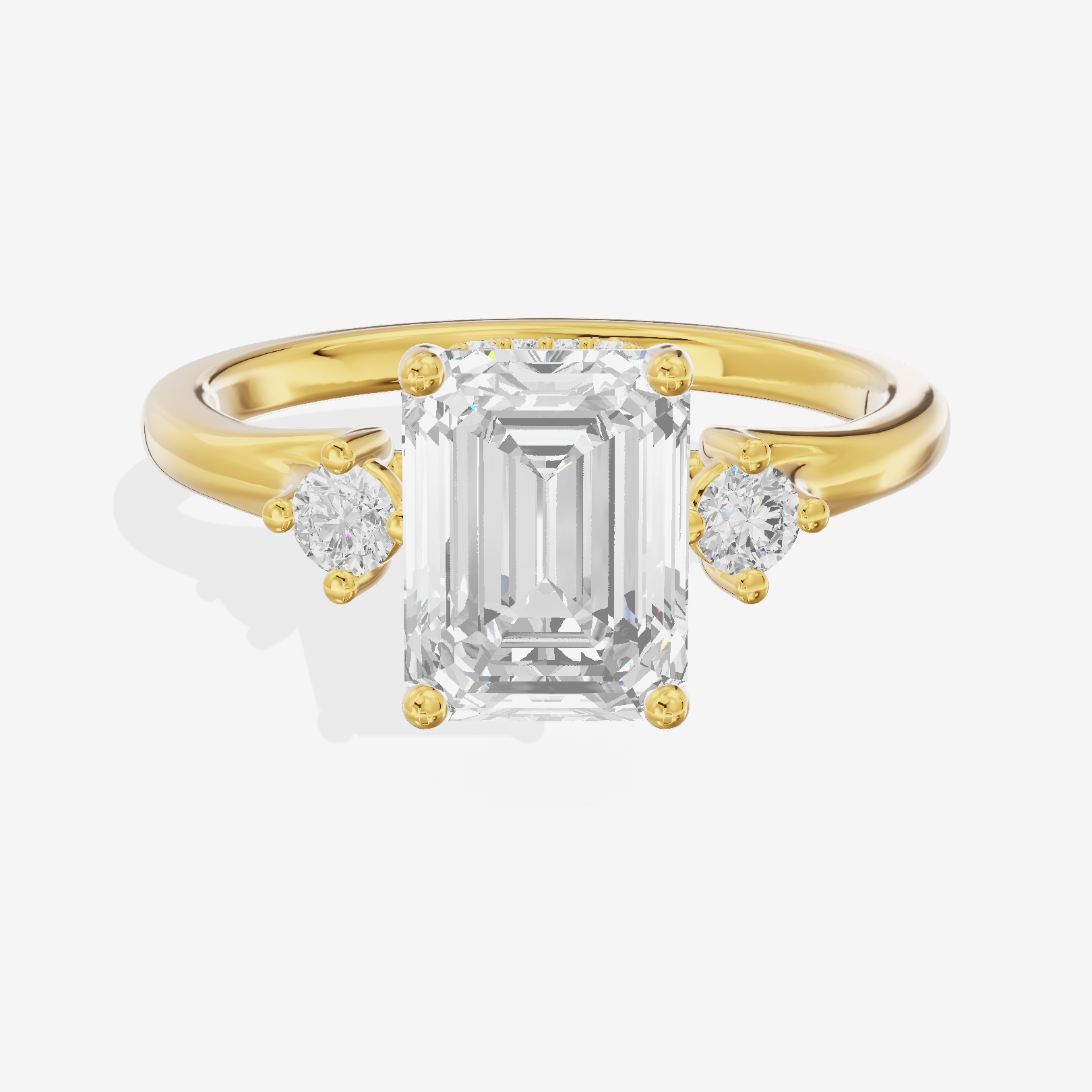 Sincere Three Stone Emerald Engagement Ring (1/6 ct. tw.) in 18K Yellow Gold