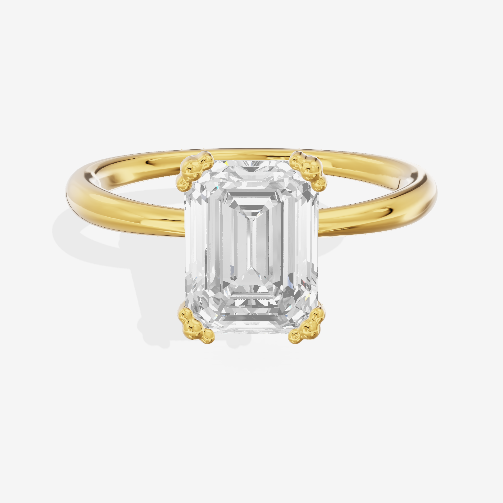 Classic Tender Emerald Solitaire Engagement Ring in 18K Yellow Gold