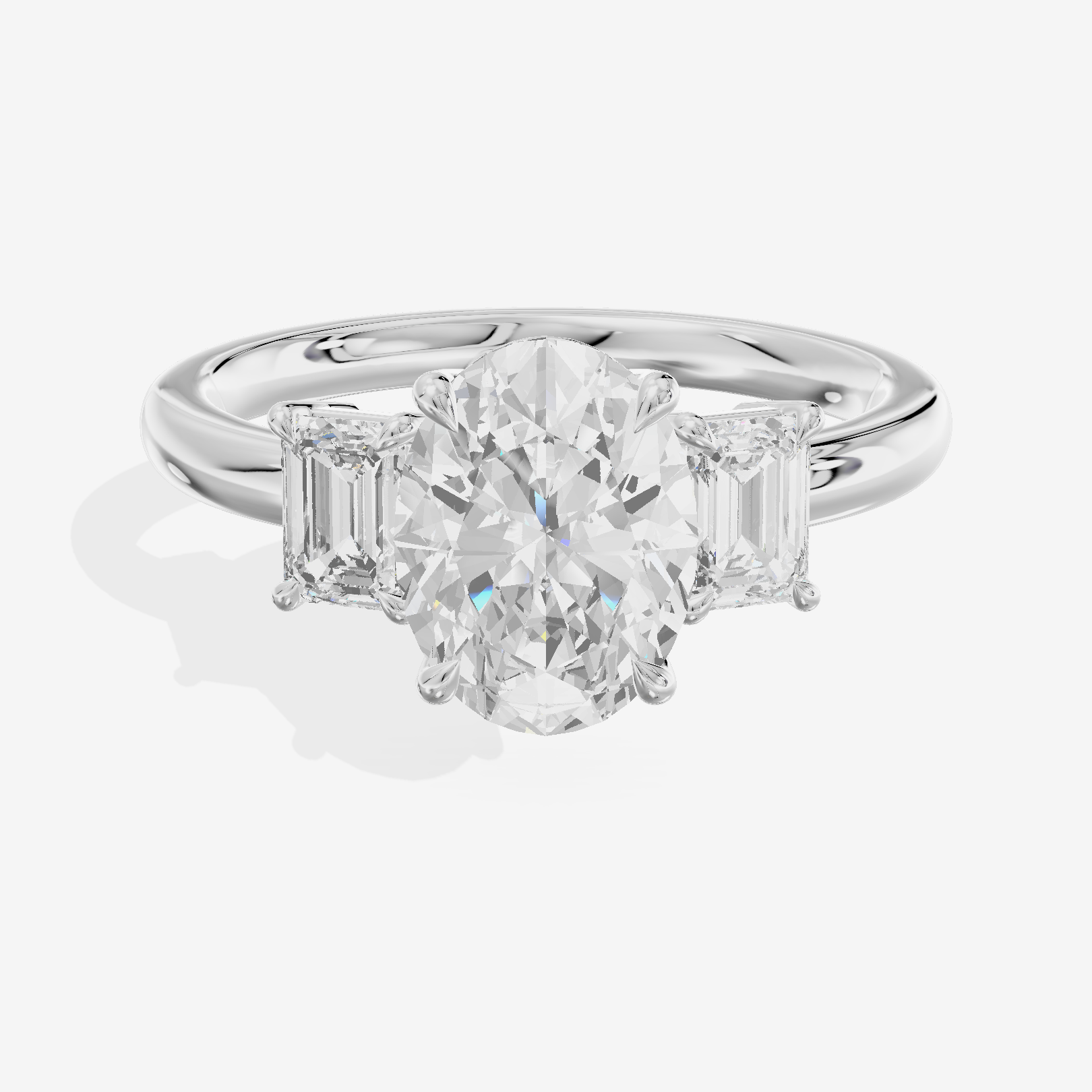 Petite Coeurine Three Stone Oval Engagement Ring (1/5 ct. tw.) in Platinum