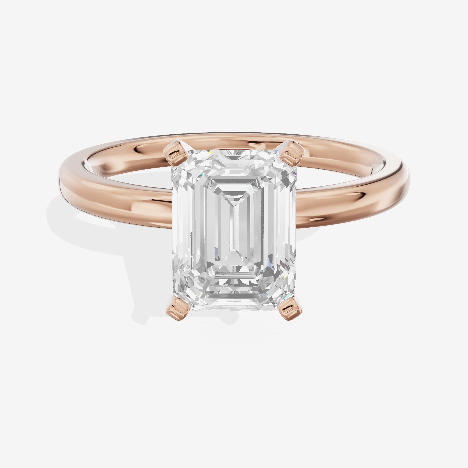 Sincere 2mm Emerald Solitaire Engagement Ring in 18K Rose Gold