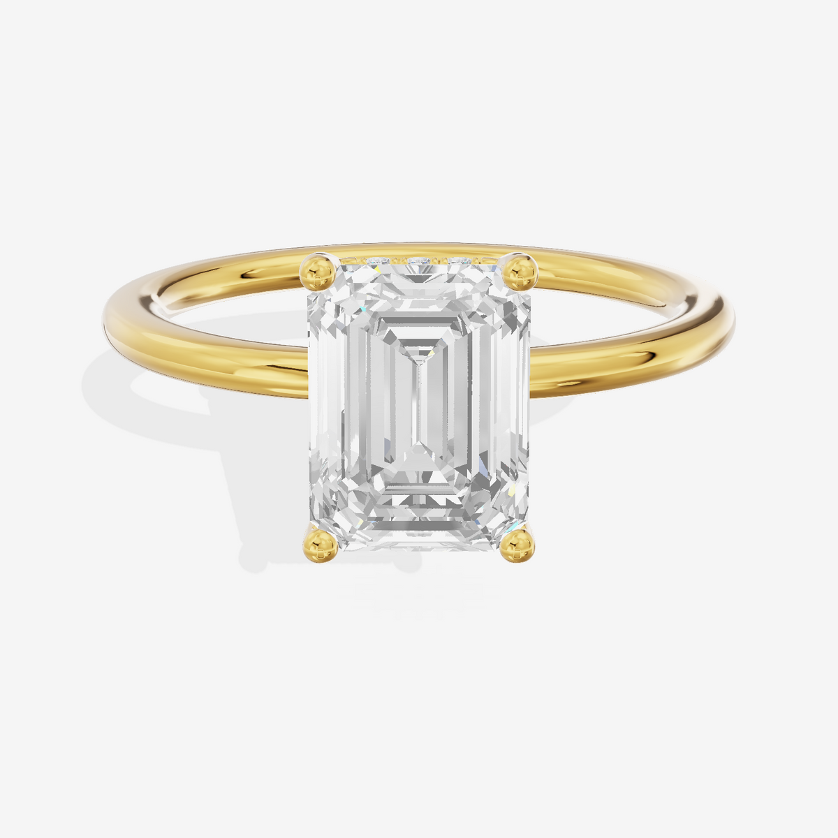 Reverya Hidden Halo Emerald Engagement Ring (1/20 ct. tw.) in 18K Yellow Gold