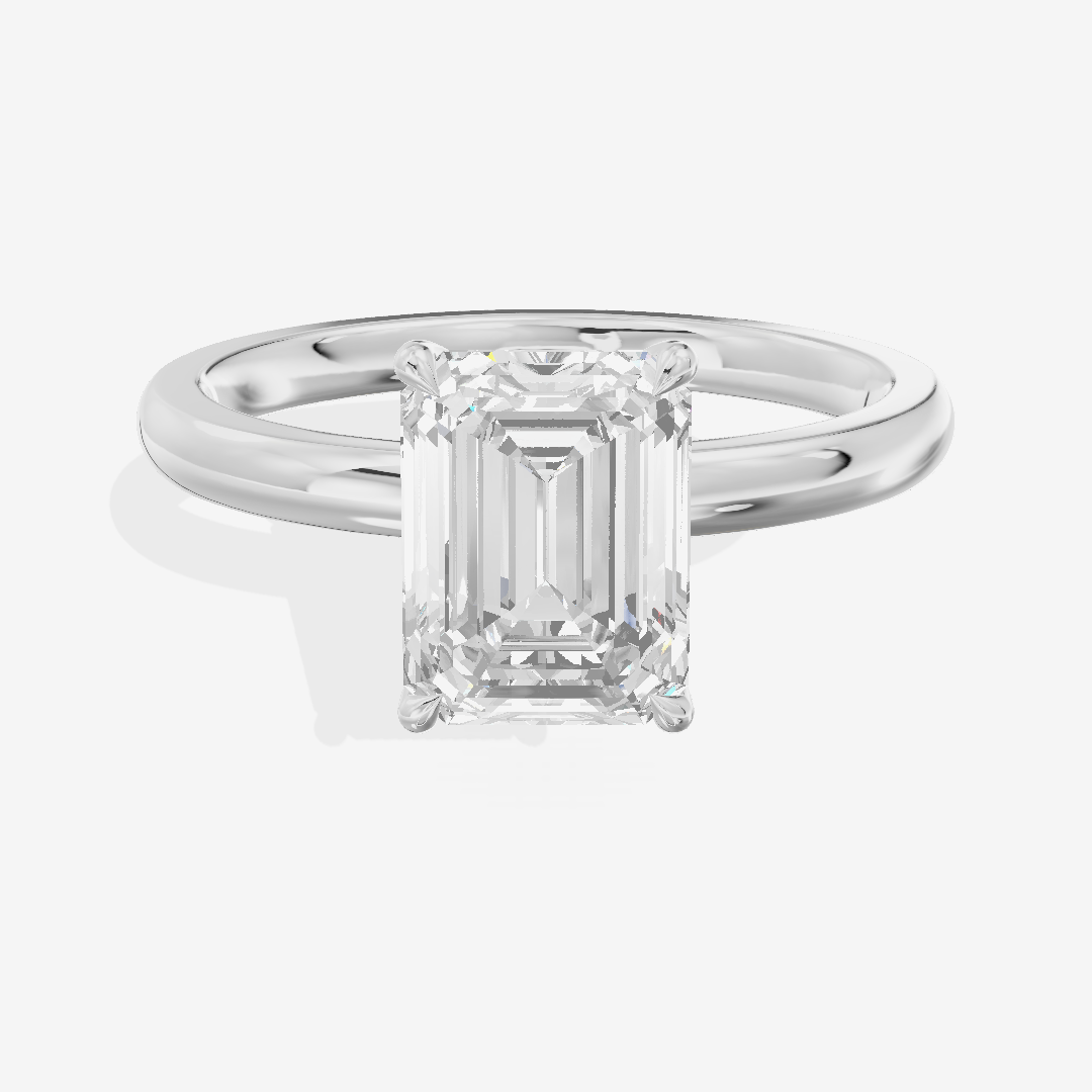 Petite Tender 2mm Emerald Solitaire Engagement Ring in Platinum