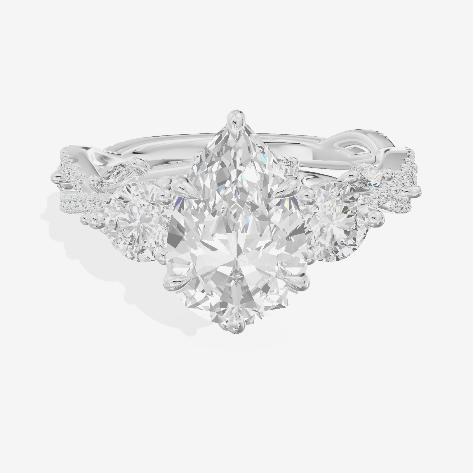 Classic Coeurine Three Stone Pear Engagement Ring (3/5 ct. tw.) in Platinum