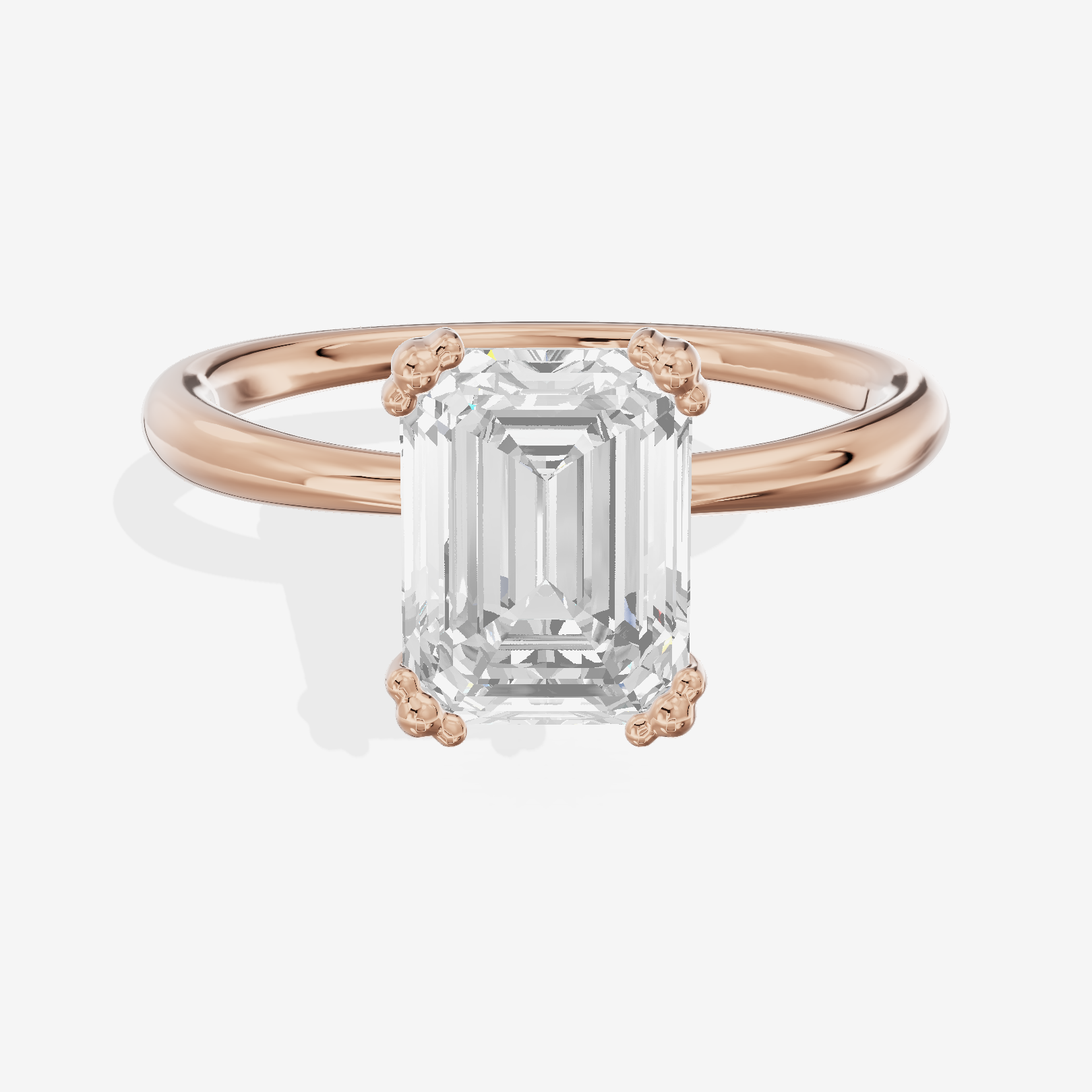 Classic Tender Emerald Solitaire Engagement Ring in 14K Rose Gold