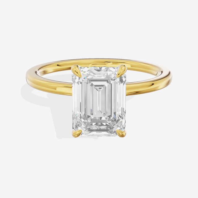 Sincere Halo Emerald Engagement Ring (1/15 ct. tw.) in 14K Yellow Gold